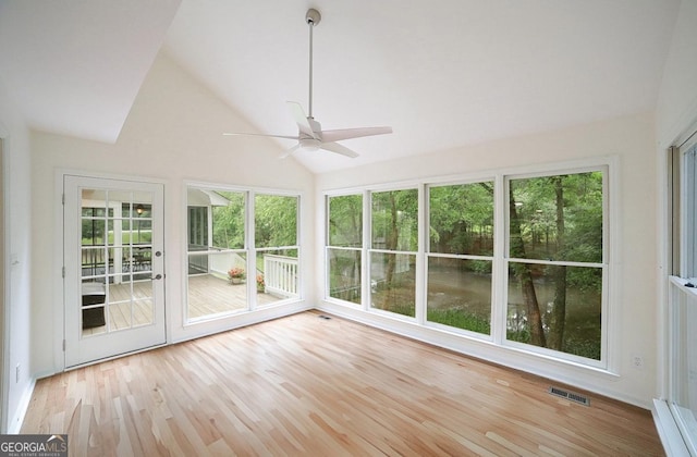 1111 Creekshore Dr, Athens, GA 30606 - unfurnished sunroom featuring plenty of natural light, lofted ceiling, wood finished floors, and a wooden deck
