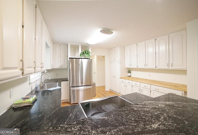 1111 Creekshore Dr, Athens, GA 30606 - kitchen with freestanding refrigerator, a sink, open shelves, white cabinetry, and light wood-style flooring