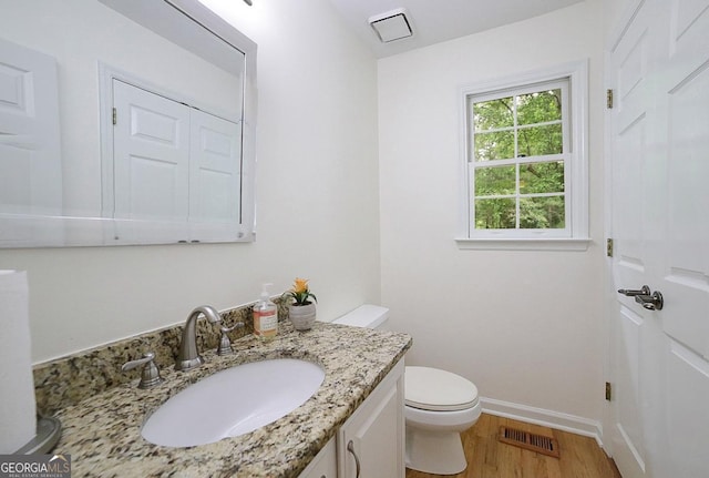 1111 Creekshore Dr, Athens, GA 30606 - half bath with toilet, vanity, wood finished floors, and baseboards