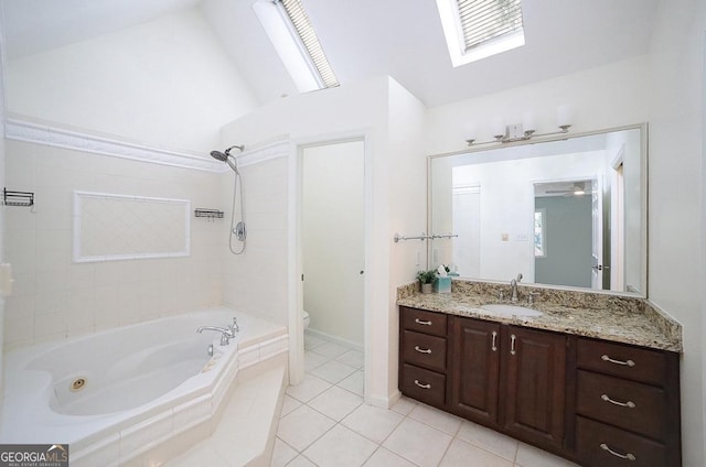 1111 Creekshore Dr, Athens, GA 30606 - bathroom featuring tile patterned flooring, toilet, a skylight, vanity, and vaulted ceiling