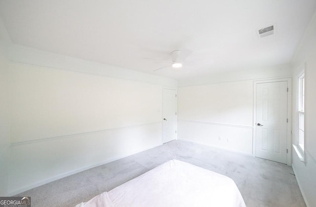 1111 Creekshore Dr, Athens, GA 30606 - unfurnished bedroom featuring light colored carpet and a ceiling fan