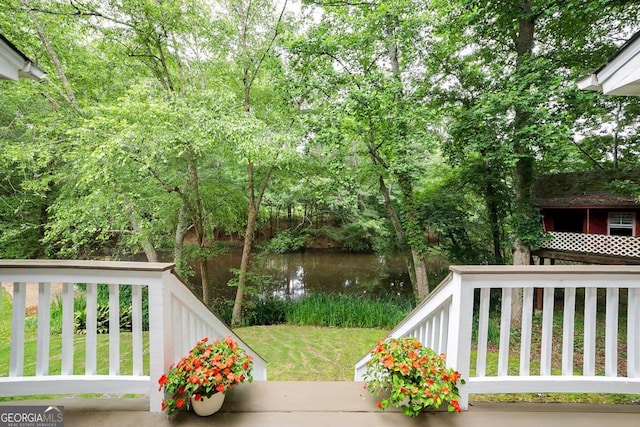 1111 Creekshore Dr, Athens, GA 30606 - wooden terrace with a water view and a lawn