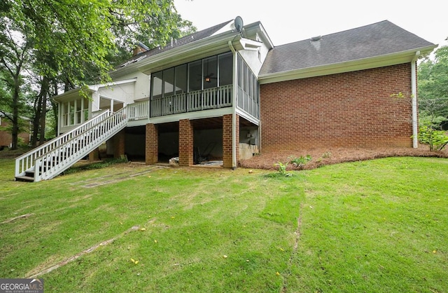 1111 Creekshore Dr, Athens, GA 30606 - rear view of property featuring a sunroom, stairway, brick siding, and a yard
