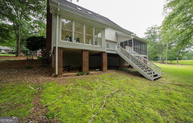 1111 Creekshore Dr, Athens, GA 30606 - rear view of property with a sunroom, stairway, a yard, and central AC