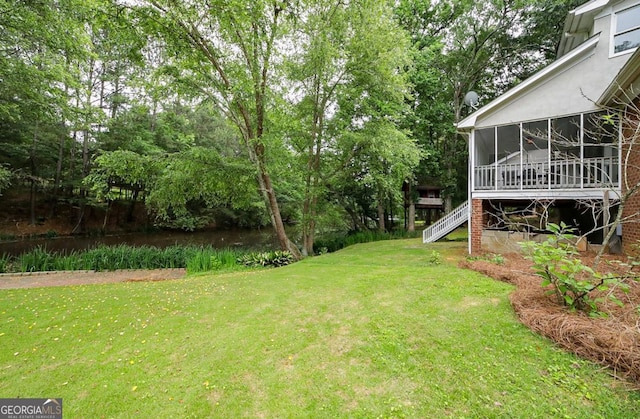 1111 Creekshore Dr, Athens, GA 30606 - view of green lawn with a sunroom and stairs