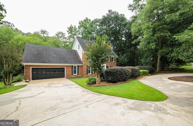 1111 Creekshore Dr, Athens, GA 30606 - view of front of property with concrete driveway, brick siding, and a garage
