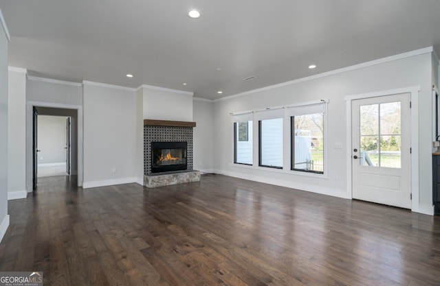 114 Cartecay River Run, Ellijay, GA 30536 - unfurnished living room with dark wood finished floors, ornamental molding, a tile fireplace, recessed lighting, and baseboards