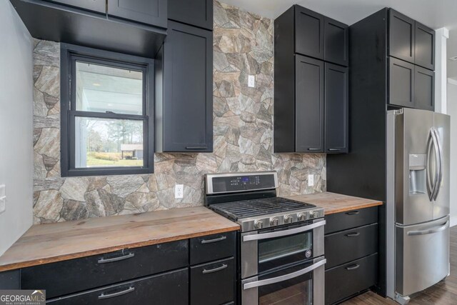 114 Cartecay River Run, Ellijay, GA 30536 - kitchen with wood counters, appliances with stainless steel finishes, backsplash, and dark wood-style floors