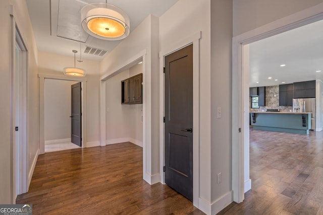 114 Cartecay River Run, Ellijay, GA 30536 - corridor with attic access, dark wood finished floors, and baseboards