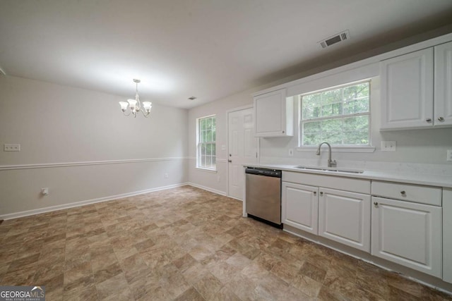 40 Heather Woods Ct, Covington, GA 30016 - kitchen featuring stainless steel dishwasher, a chandelier, white cabinets, light countertops, and decorative light fixtures