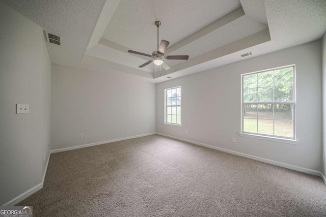 40 Heather Woods Ct, Covington, GA 30016 - carpeted empty room featuring a raised ceiling and ceiling fan