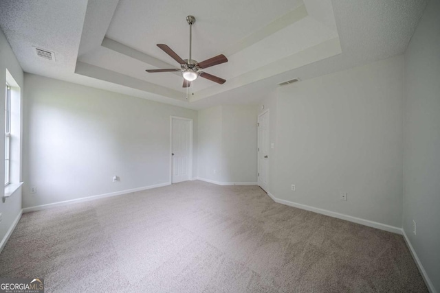 40 Heather Woods Ct, Covington, GA 30016 - carpeted spare room with a tray ceiling and a ceiling fan
