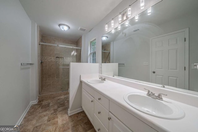 40 Heather Woods Ct, Covington, GA 30016 - bathroom with a shower stall, double vanity, and stone finish flooring