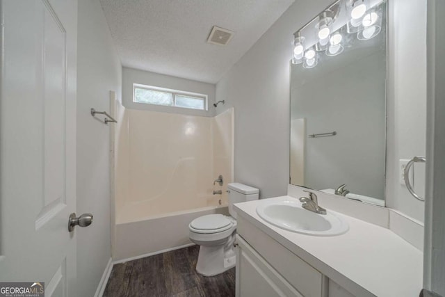 40 Heather Woods Ct, Covington, GA 30016 - full bathroom featuring vanity, wood finished floors, bathing tub / shower combination, and a textured ceiling