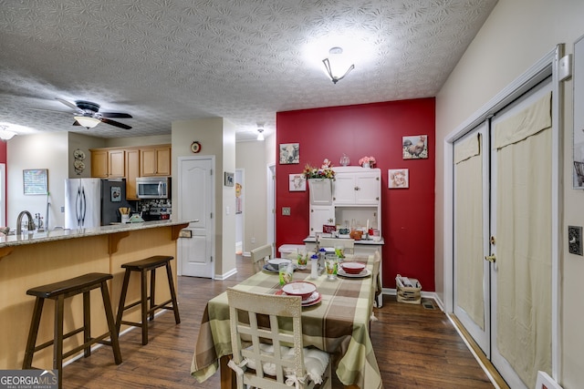 129 Onyx Ct, Carrollton, GA 30116 - dining space featuring dark wood-style flooring, ceiling fan, and baseboards