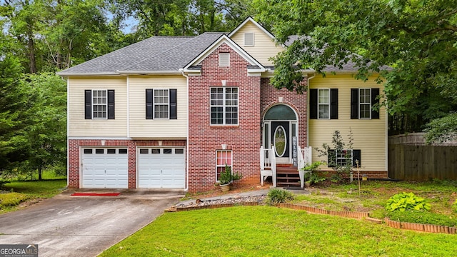 129 Onyx Ct, Carrollton, GA 30116 - bi-level home with concrete driveway, an attached garage, and brick siding