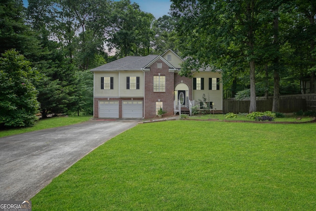 129 Onyx Ct, Carrollton, GA 30116 - bi-level home featuring brick siding, concrete driveway, and an attached garage
