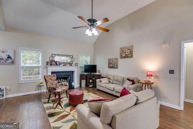 129 Onyx Ct, Carrollton, GA 30116 - living room with dark wood-type flooring, a ceiling fan, healthy amount of natural light, and high vaulted ceiling