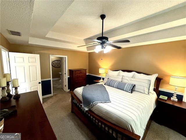 298 Moorings Run, Jasper, GA 30143 - bedroom with carpet flooring, a textured ceiling, a tray ceiling, and ceiling fan