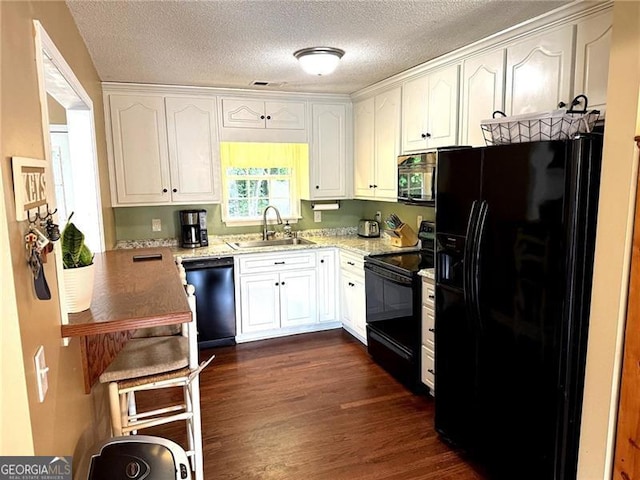298 Moorings Run, Jasper, GA 30143 - kitchen with black appliances, white cabinetry, dark wood-style flooring, light stone countertops, and a textured ceiling