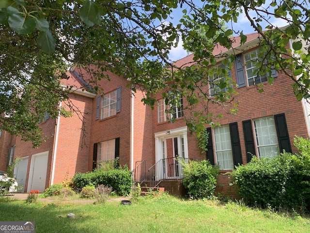 6570 Laurens Way, Stone Mountain, GA 30087 - view of front facade featuring brick siding and a garage