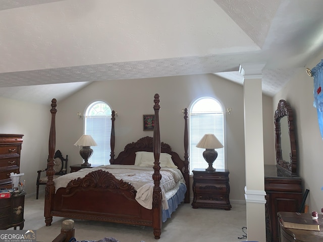 6570 Laurens Way, Stone Mountain, GA 30087 - bedroom featuring lofted ceiling, light carpet, and multiple windows