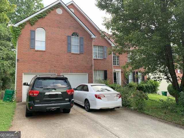 6570 Laurens Way, Stone Mountain, GA 30087 - view of front of house featuring concrete driveway, brick siding, and an attached garage