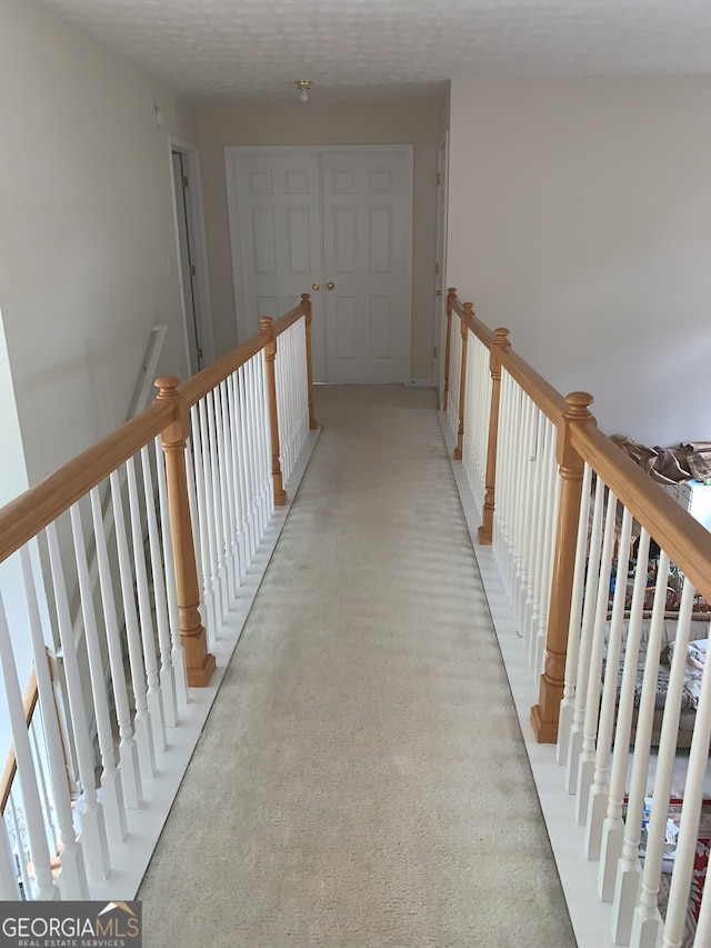6570 Laurens Way, Stone Mountain, GA 30087 - hall with an upstairs landing and light carpet