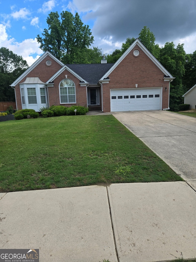 1925 Cedar Walk Ln, Conley, GA 30288 - single story home featuring brick siding, an attached garage, a front yard, and driveway