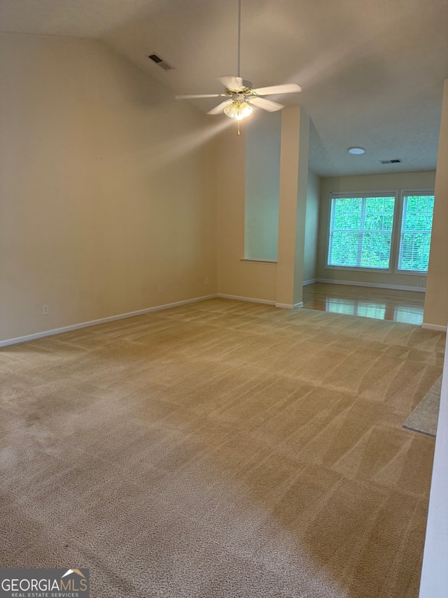1925 Cedar Walk Ln, Conley, GA 30288 - carpeted empty room featuring baseboards, ceiling fan, and lofted ceiling