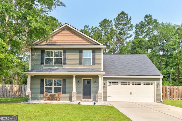 304 Boomer Ct, Guyton, GA 31312 - craftsman-style house with covered porch, driveway, and a garage