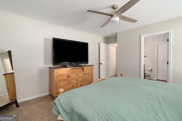 304 Boomer Ct, Guyton, GA 31312 - bedroom with light colored carpet, connected bathroom, baseboards, and a ceiling fan