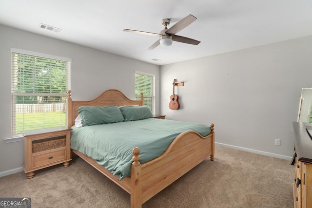 304 Boomer Ct, Guyton, GA 31312 - bedroom featuring light colored carpet, baseboards, and ceiling fan