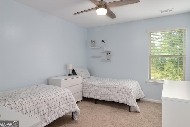 304 Boomer Ct, Guyton, GA 31312 - bedroom with light carpet, multiple windows, ceiling fan, and baseboards