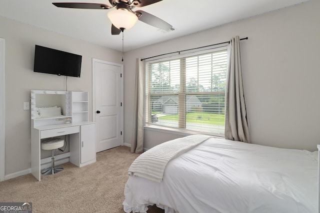304 Boomer Ct, Guyton, GA 31312 - bedroom with light carpet, baseboards, and a ceiling fan