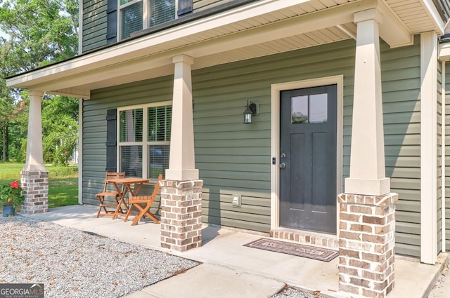 304 Boomer Ct, Guyton, GA 31312 - doorway to property with covered porch