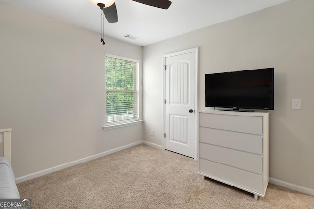 304 Boomer Ct, Guyton, GA 31312 - unfurnished bedroom with baseboards, light colored carpet, and a ceiling fan
