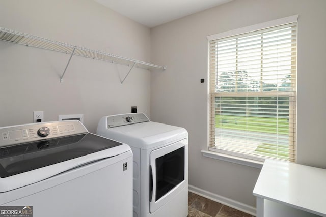304 Boomer Ct, Guyton, GA 31312 - laundry room with washing machine and dryer, plenty of natural light, and baseboards