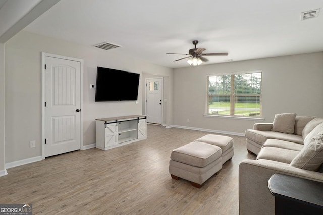 304 Boomer Ct, Guyton, GA 31312 - living area with baseboards, ceiling fan, and light wood-style floors