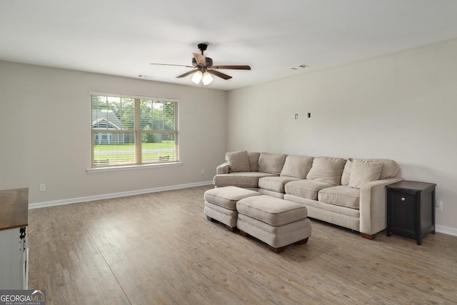 304 Boomer Ct, Guyton, GA 31312 - living area featuring a ceiling fan, light wood-style floors, and baseboards