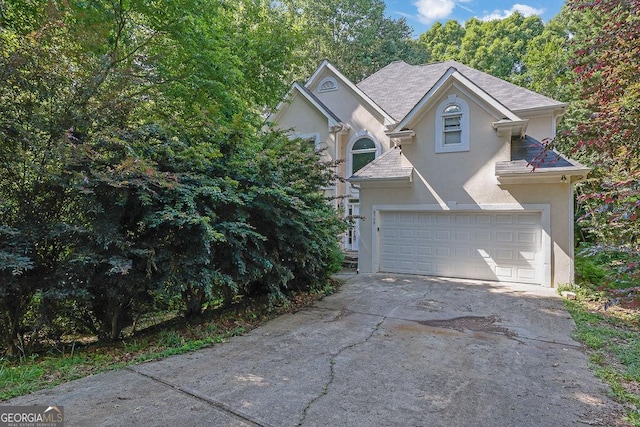 6708 Thornwood Ct, Flowery Branch, GA 30542 - traditional home with stucco siding, driveway, and a garage