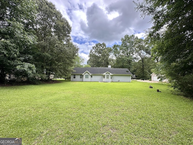 150 Willow Shoals Dr, Covington, GA 30016 - view of green lawn featuring view of wooded area