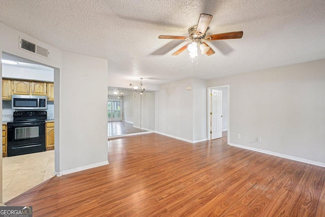 514 Mcgill Pl NE, Atlanta, GA 30312 - unfurnished living room featuring ceiling fan, light wood-type flooring, a chandelier, a textured ceiling, and baseboards