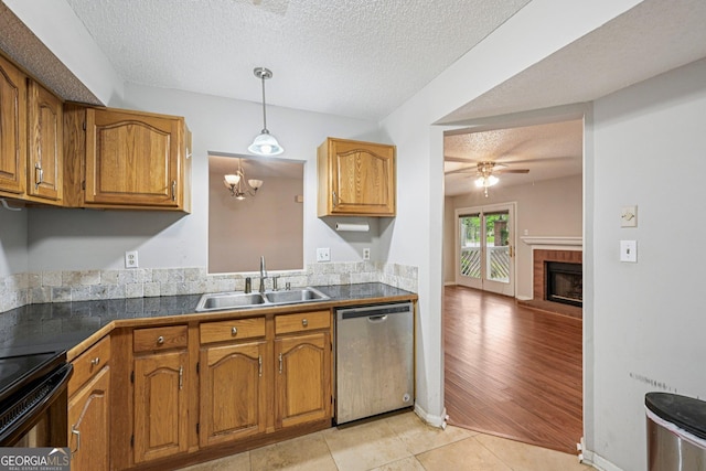 514 Mcgill Pl NE, Atlanta, GA 30312 - kitchen featuring dishwasher, a sink, brown cabinets, a ceiling fan, and a textured ceiling