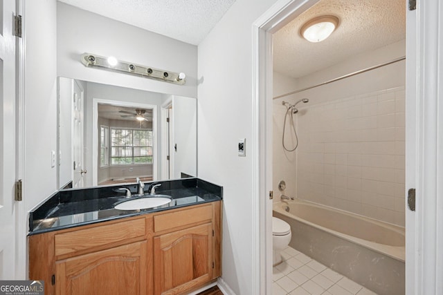 514 Mcgill Pl NE, Atlanta, GA 30312 - bathroom with toilet, tile patterned floors, a textured ceiling, vanity, and shower / tub combination