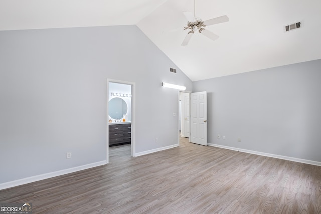 984 Wenham Ln, Lawrenceville, GA 30044 - unfurnished bedroom with high vaulted ceiling, wood finished floors, baseboards, ensuite bathroom, and ceiling fan