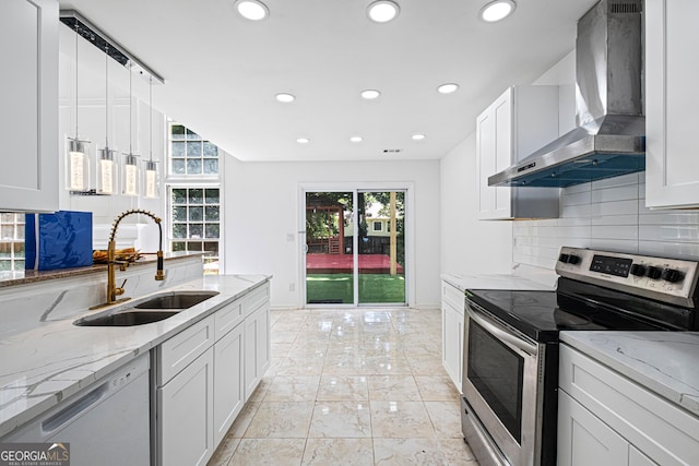 984 Wenham Ln, Lawrenceville, GA 30044 - kitchen featuring stainless steel range with electric cooktop, wall chimney exhaust hood, white dishwasher, a sink, and backsplash
