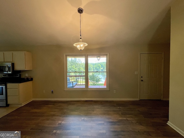 555 Barker Trail Rd, Cleveland, GA 30528 - kitchen featuring stainless steel appliances, white cabinetry, dark wood-style flooring, hanging light fixtures, and baseboards