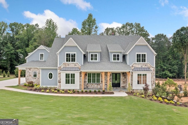 615 Claxton Ln, Milton, GA 30004 - view of front of home featuring stone siding, a front yard, a standing seam roof, and a shingled roof