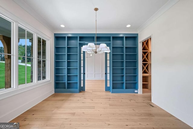 615 Claxton Ln, Milton, GA 30004 - unfurnished dining area featuring ornamental molding, a chandelier, plenty of natural light, wood finished floors, and recessed lighting